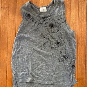Grey Anthropologie tank with black floral detail.